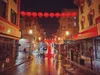 San Francsico Chinatown during a rainy night, decorated with red lanterns for Lunar New Year.