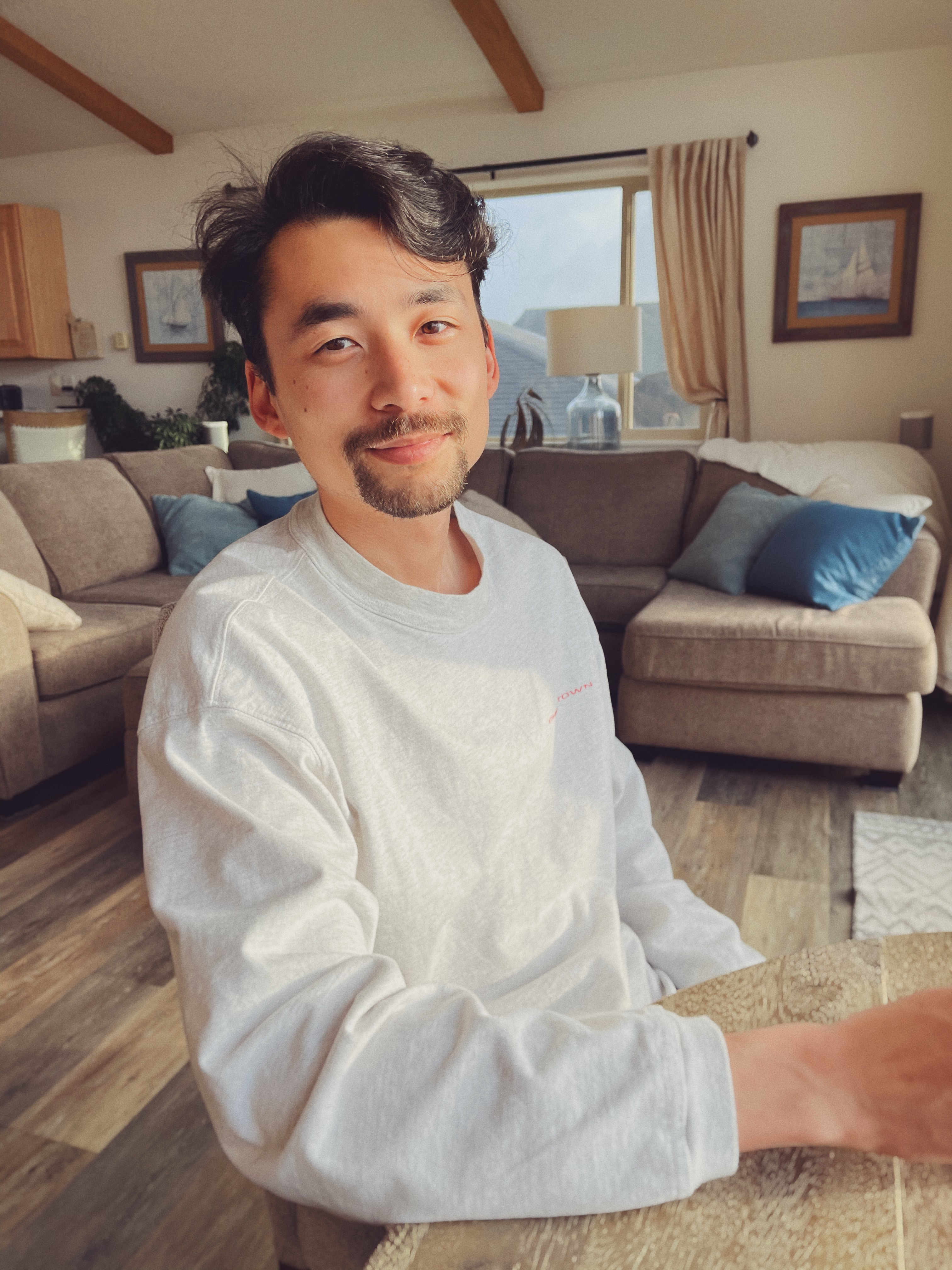 A man sitting in a vacation home by a beach in Waldport, Oregon.