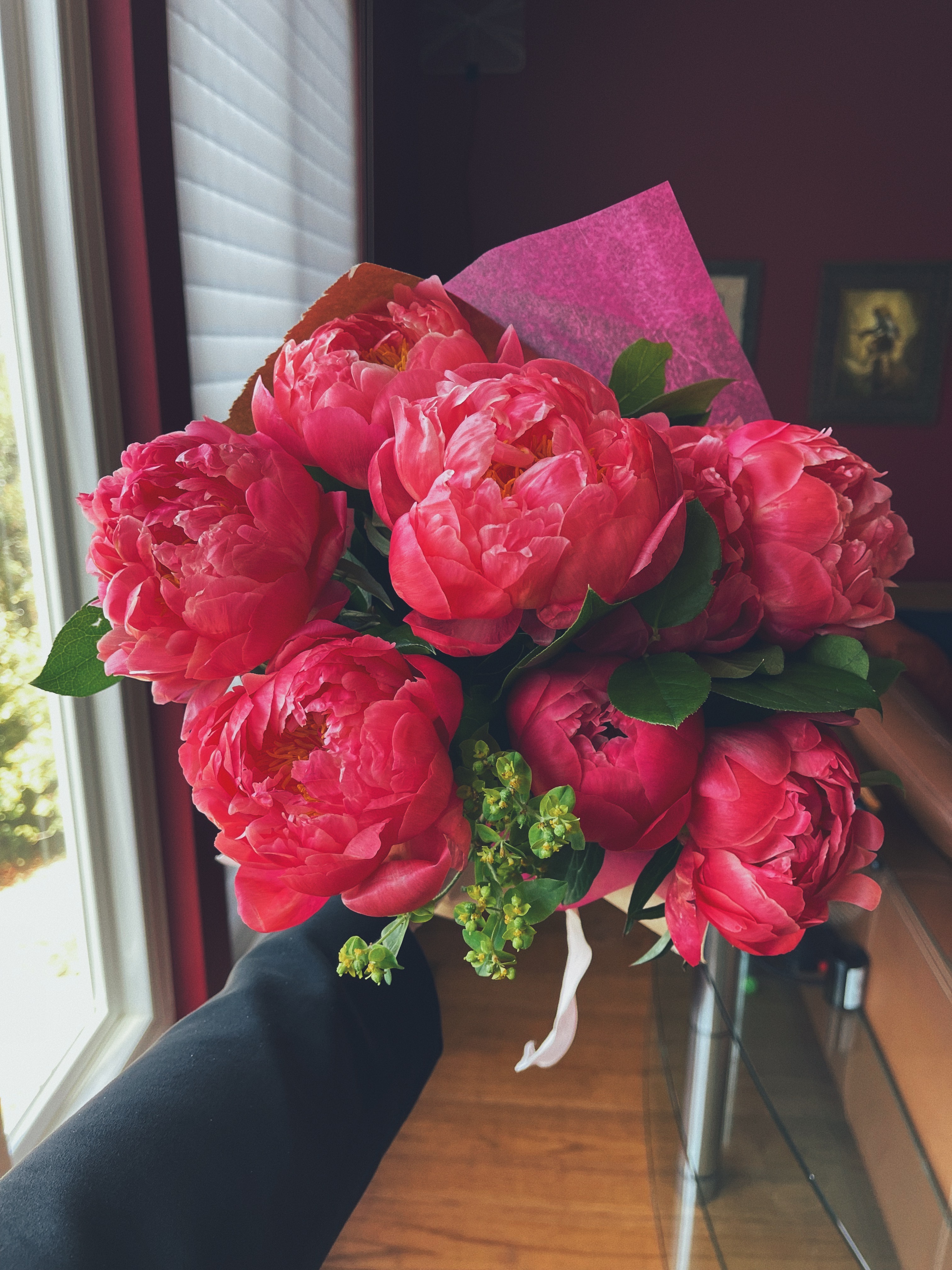 A bouquet of deep pink peonies.